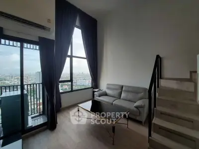 Modern living room with stunning city view and elegant staircase