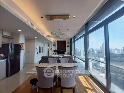 Luxurious modern living room with panoramic city view and elegant dining area