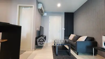 Modern living room with sleek furniture and stylish decor in a contemporary apartment.