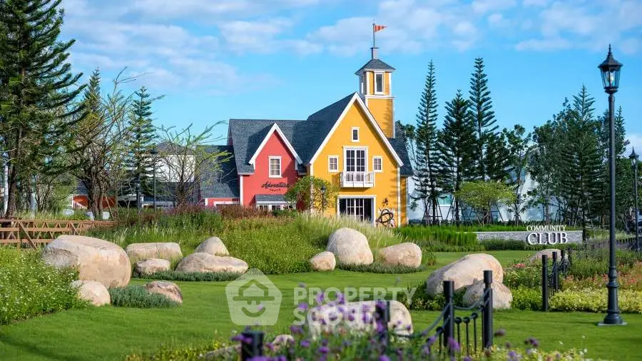 Charming colorful house with lush garden and scenic landscape, ideal for serene living.