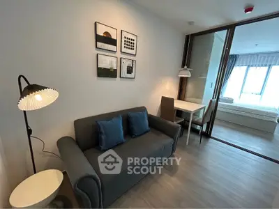 Modern living room with cozy sofa and dining area in stylish apartment