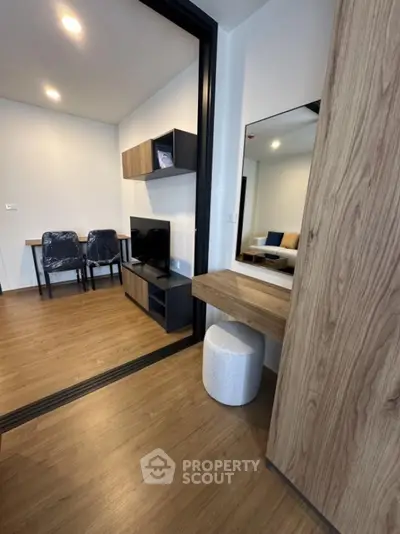 Modern living room with wooden flooring and stylish furniture