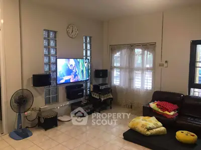 Cozy living room with modern entertainment setup and comfortable seating