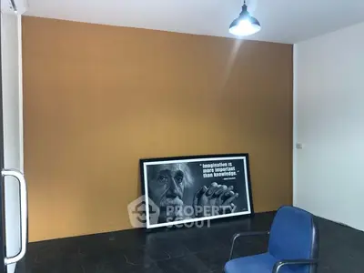Minimalist office space with modern chair and inspirational wall art