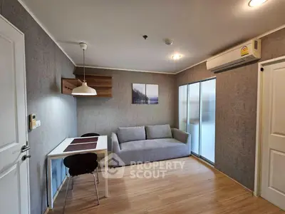 Modern living room with cozy sofa and dining area in stylish apartment