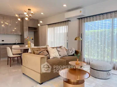 Modern living room with stylish decor and open kitchen layout