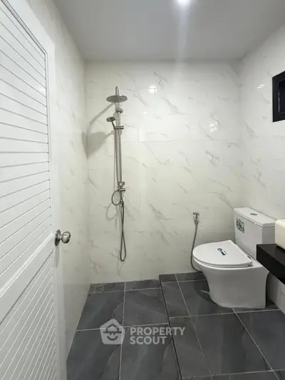 Modern bathroom with sleek shower and elegant tile design