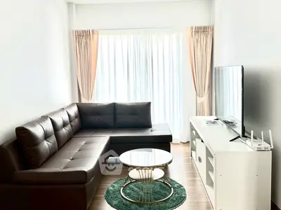 Modern living room with sleek furniture and natural light