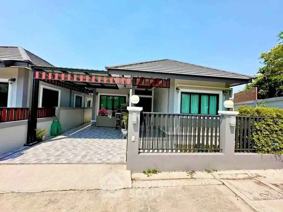 Charming single-story home with modern design and spacious driveway