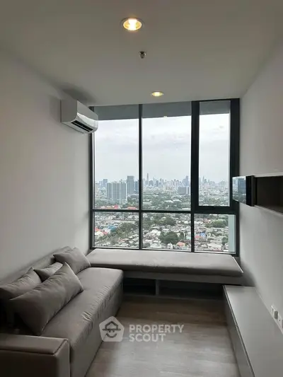 Modern living room with panoramic city view and cozy sofa