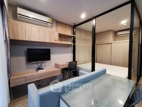 Modern studio apartment with sleek design and built-in furniture