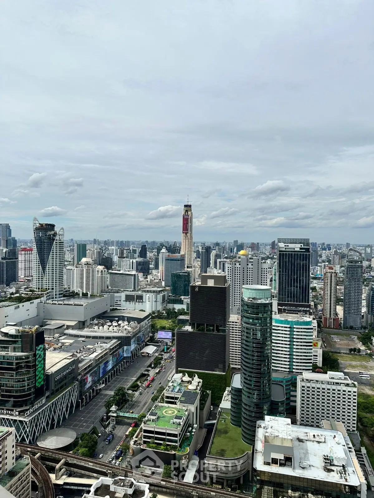 Stunning cityscape view from high-rise building showcasing urban skyline and modern architecture.