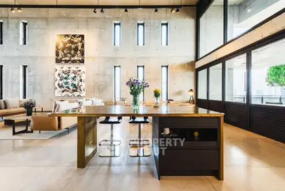 Luxurious modern living room with high ceilings and stylish decor