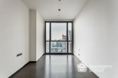 Spacious and modern empty living room with large windows offering a panoramic city view, glossy floor, and ample natural light, ideal for interior customization.