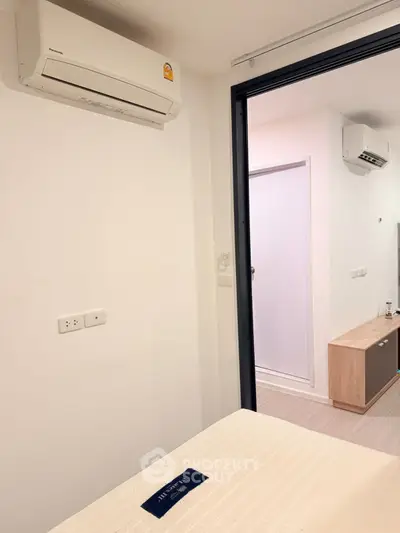 Modern bedroom with air conditioning and minimalist decor