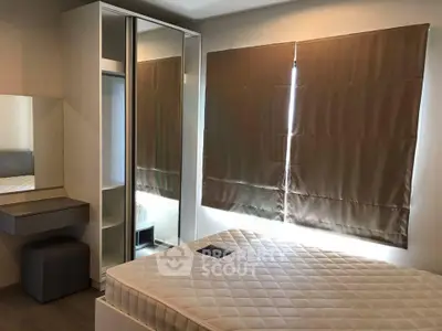 Modern bedroom with large mirrored wardrobe and stylish blinds