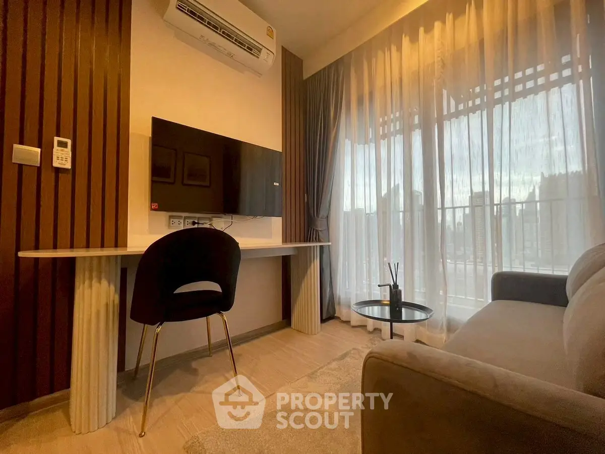 Modern living room with sleek furniture and large window view