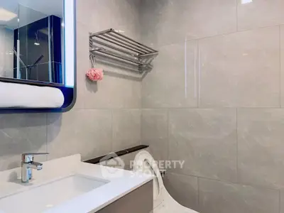 Modern bathroom with sleek fixtures and elegant tile design