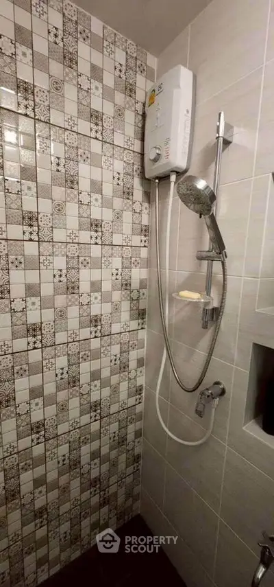 Modern bathroom with stylish tile design and shower unit