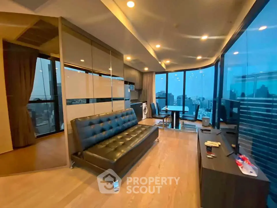Modern living room with panoramic city views and sleek furnishings