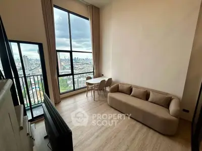 Modern living room with large windows and city view, featuring a cozy sofa and dining area.