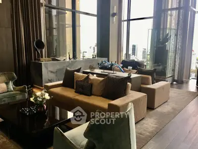 Luxurious high-rise living room with floor-to-ceiling windows and elegant decor.
