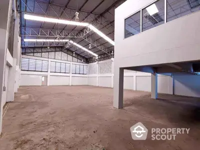 Spacious industrial warehouse with high ceilings and ample natural light