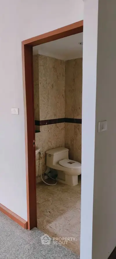 Modern bathroom with elegant stone tiles and sleek fixtures