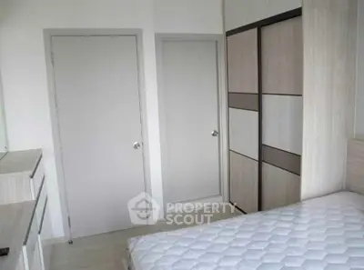 Modern bedroom with sleek wardrobe and minimalist design