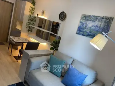 Modern living room with stylish decor and cozy seating area, perfect for relaxation and entertaining.
