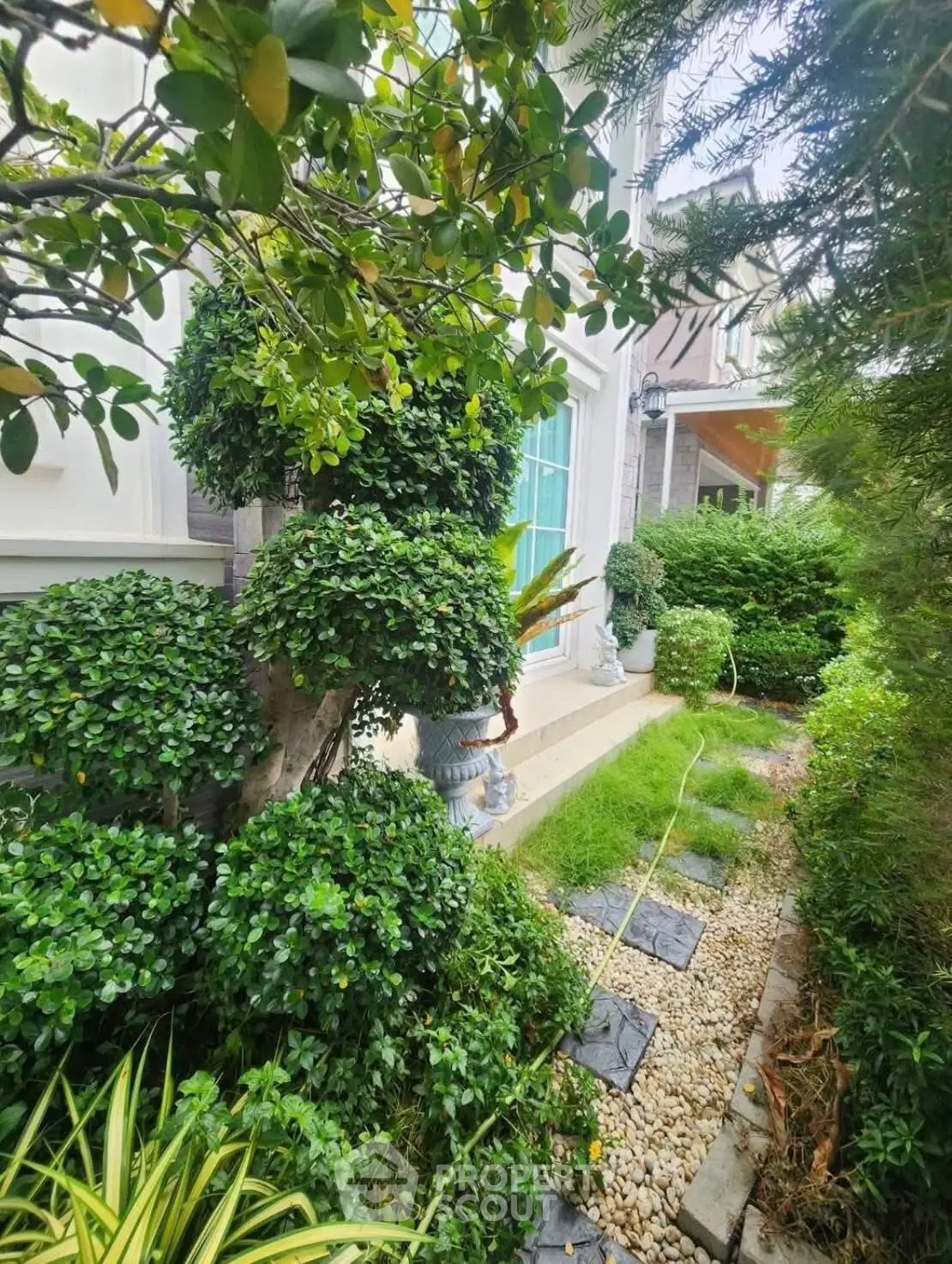 Charming garden view with lush greenery and elegant landscaping