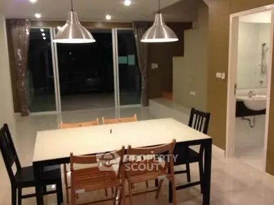 Modern dining area with sleek lighting and open layout, perfect for entertaining.