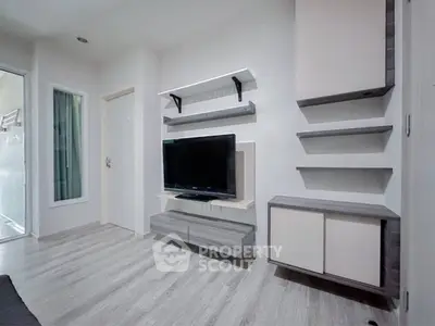 Modern living room with sleek TV setup and stylish shelving