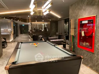 Luxurious modern living room with pool table and stylish lighting