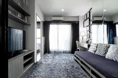 Modern living room with stylish decor and large window for natural light