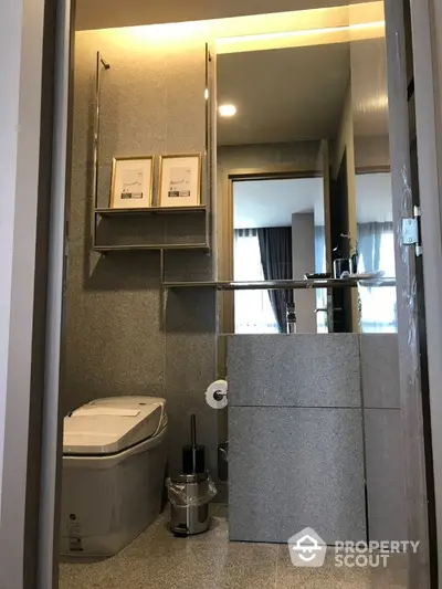 Modern bathroom with sleek design and contemporary fixtures in a stylish apartment.