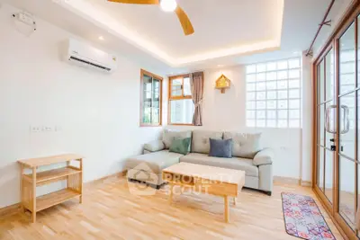 Bright and airy living room with modern furniture and wooden flooring