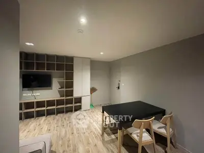 Modern living room with sleek furniture and built-in shelving, perfect for contemporary living.