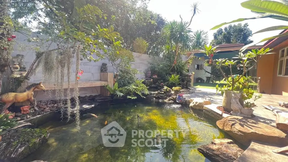 Serene garden with koi pond and lush greenery in a tranquil backyard setting.