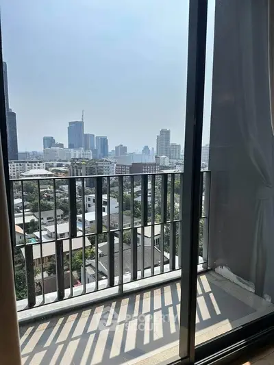 Stunning cityscape view from a modern apartment balcony, perfect for urban living.