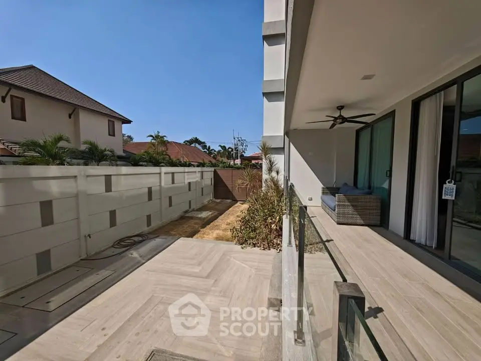 Modern villa with spacious patio and garden view in sunny residential area