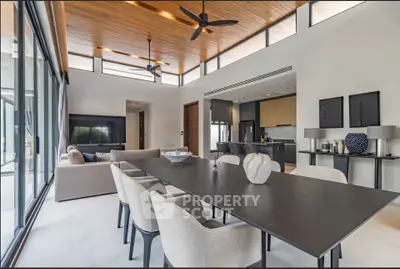 Spacious modern living room with open kitchen and elegant dining area