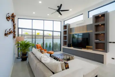 Modern living room with large windows and stylish decor
