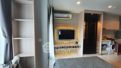 Modern studio apartment with sleek design and built-in appliances