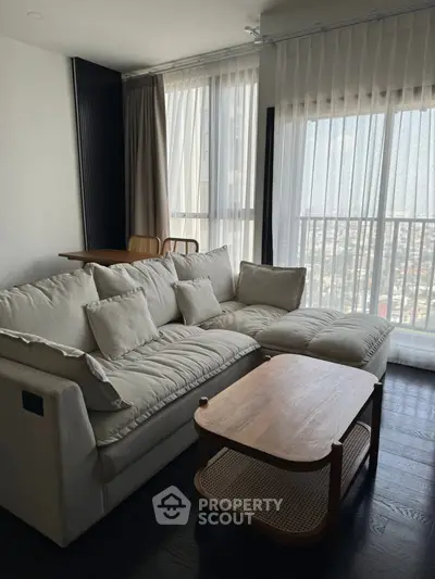 Modern living room with cozy sofa and panoramic city view