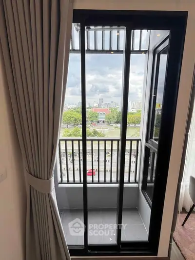 Charming balcony with city view, perfect for relaxation and enjoying the skyline.