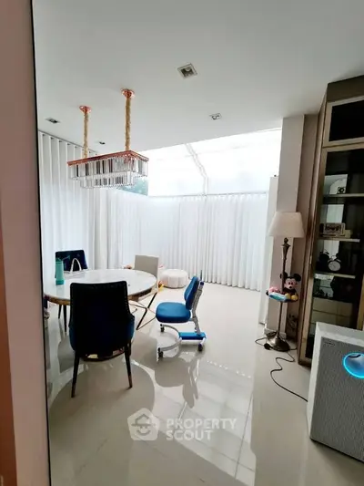 Elegant study room with modern furniture and natural light, perfect for productivity and comfort.