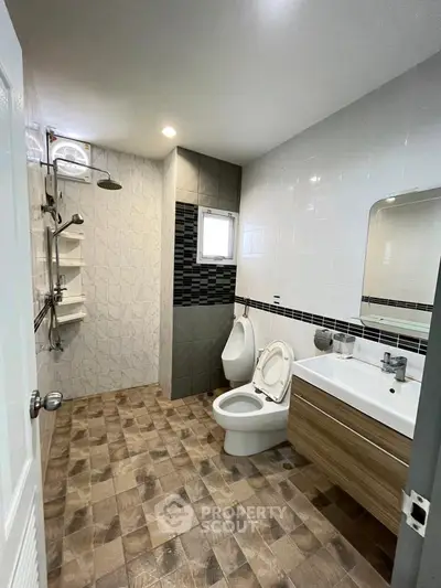 Modern bathroom with sleek fixtures and stylish tile flooring