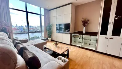 Spacious living room with stunning river view and modern decor