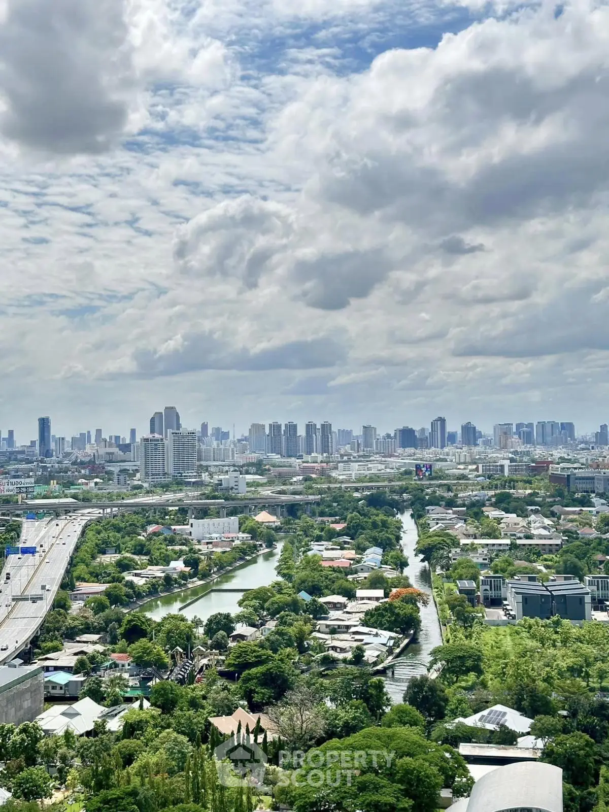 Stunning cityscape view with lush greenery and skyline, perfect for urban living enthusiasts.